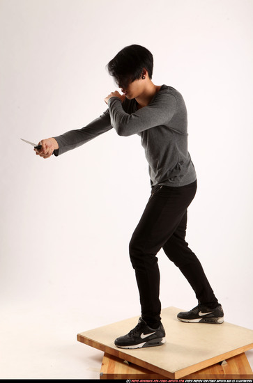 Man Young Athletic Fighting with knife Standing poses Casual Asian