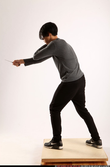 Man Young Athletic Fighting with knife Standing poses Casual Asian