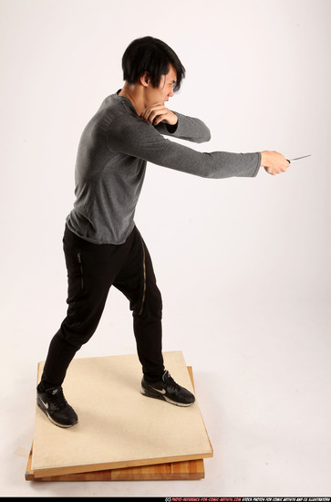 Man Young Athletic Fighting with knife Standing poses Casual Asian