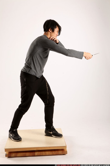 Man Young Athletic Fighting with knife Standing poses Casual Asian