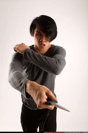 Man Young Athletic Fighting with knife Standing poses Casual Asian