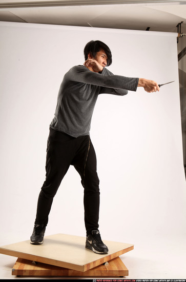 Man Young Athletic Fighting with knife Standing poses Casual Asian