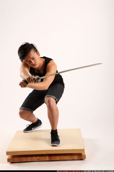 Man Young Athletic Fighting with sword Kneeling poses Sportswear Asian