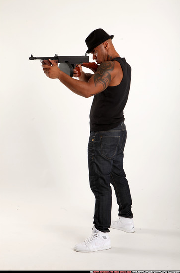 Man Adult Athletic Black Fighting with submachine gun Standing poses Casual