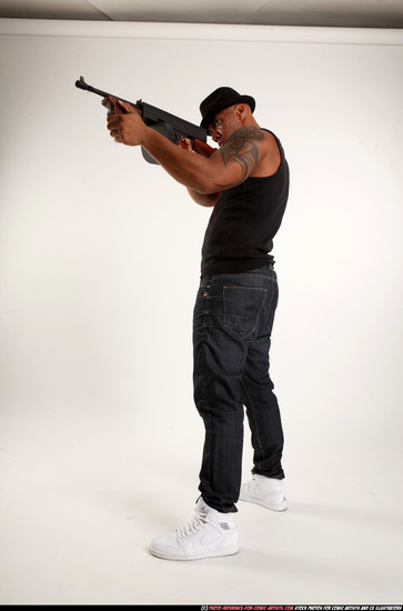 Man Adult Athletic Black Fighting with submachine gun Standing poses Casual