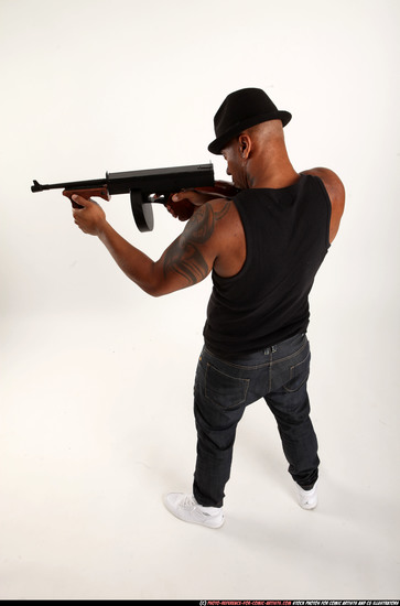 Man Adult Athletic Black Fighting with submachine gun Standing poses Casual