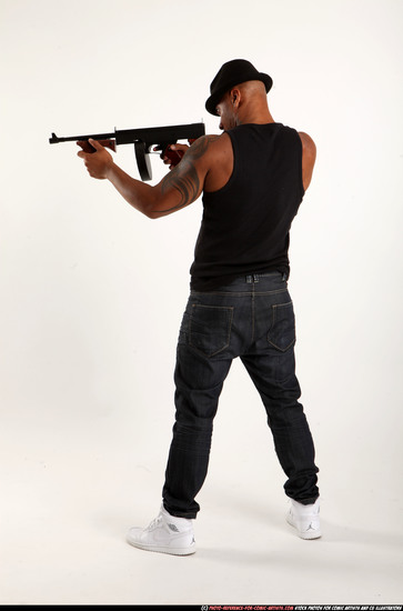 Man Adult Athletic Black Fighting with submachine gun Standing poses Casual