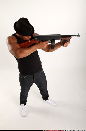 Man Adult Athletic Black Fighting with submachine gun Standing poses Casual