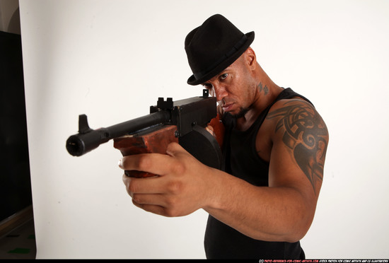 Man Adult Athletic Black Fighting with submachine gun Standing poses Casual