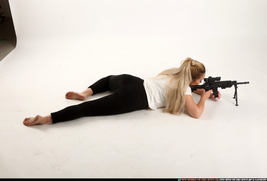 Woman Young Average Fighting with submachine gun Laying poses Casual Asian