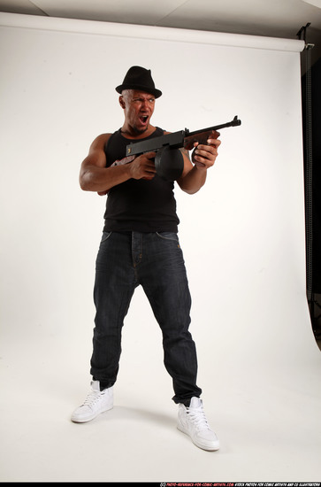 Man Adult Athletic Black Fighting with submachine gun Standing poses Casual