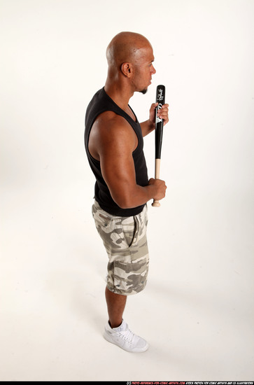 Man Adult Athletic Black Standing poses Sportswear Fighting with bat