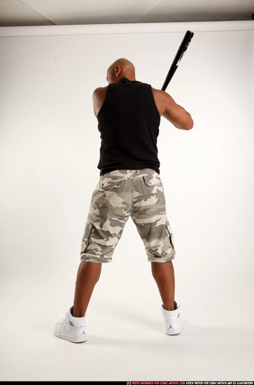 Man Adult Athletic Black Standing poses Sportswear Fighting with bat