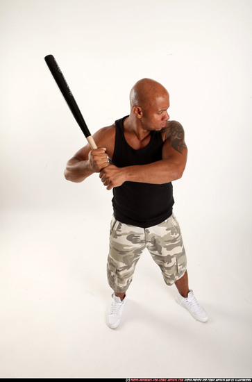 Man Adult Athletic Black Standing poses Sportswear Fighting with bat