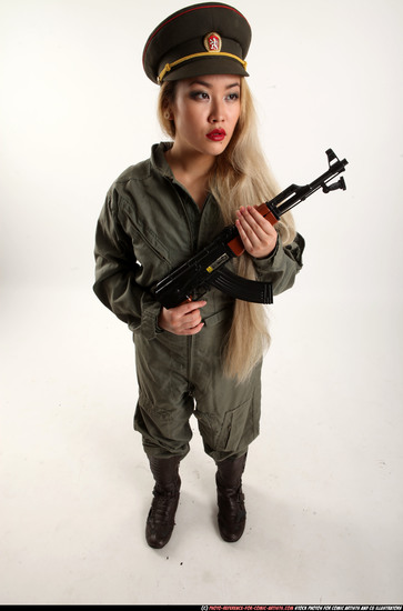 Woman Young Average Fighting with submachine gun Standing poses Army Asian