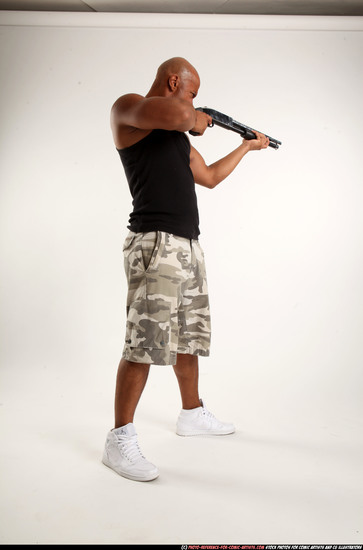 Man Adult Athletic Black Standing poses Sportswear Fighting with shotgun