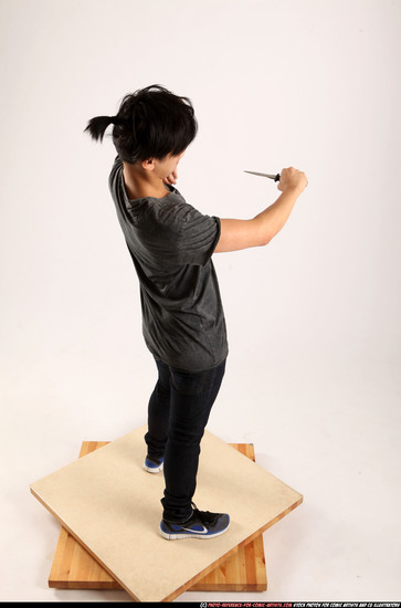 Man Young Athletic Fighting with knife Standing poses Casual Asian