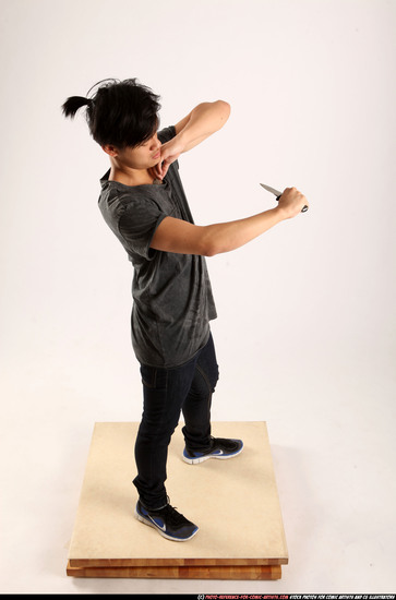 Man Young Athletic Fighting with knife Standing poses Casual Asian