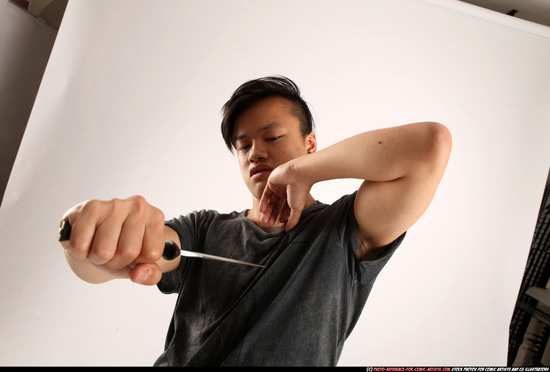 Man Young Athletic Fighting with knife Standing poses Casual Asian