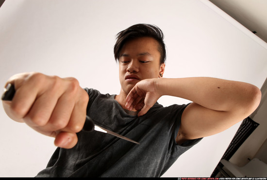 Man Young Athletic Fighting with knife Standing poses Casual Asian