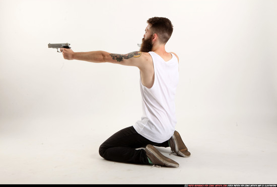 Man Adult Athletic White Fighting with gun Kneeling poses Casual