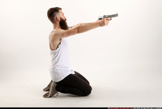 Man Adult Athletic White Fighting with gun Kneeling poses Casual