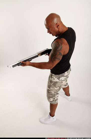 Man Adult Athletic Black Standing poses Sportswear Fighting with shotgun