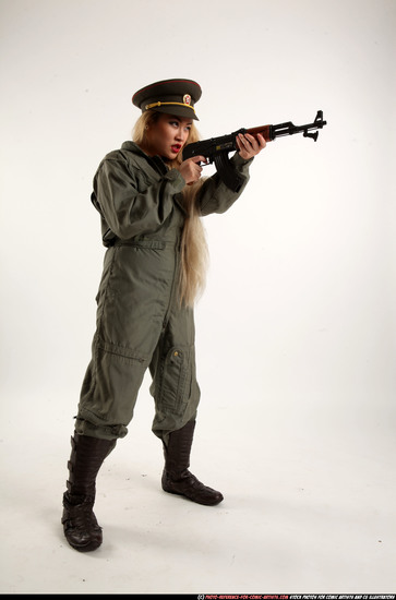 Woman Young Average Fighting with submachine gun Standing poses Army Asian