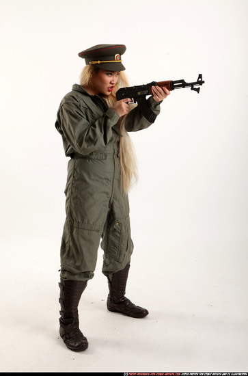 Woman Young Average Fighting with submachine gun Standing poses Army Asian