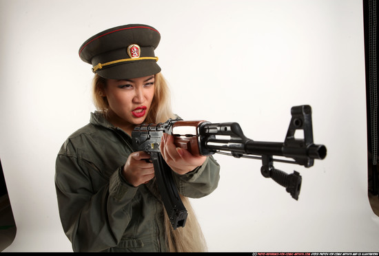 Woman Young Average Fighting with submachine gun Standing poses Army Asian