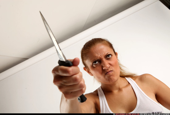 Woman Adult Athletic White Fighting with knife Standing poses Casual