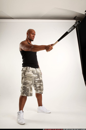 Man Adult Athletic Black Standing poses Sportswear Fighting with bat