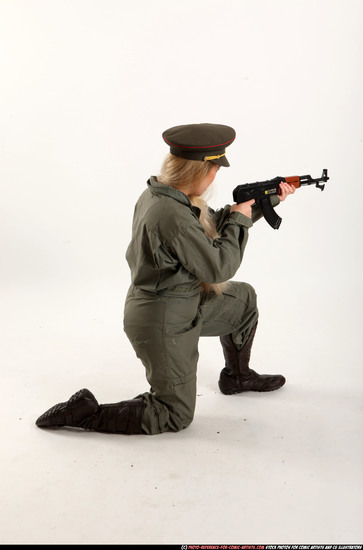 Woman Young Average Fighting with submachine gun Kneeling poses Army Asian