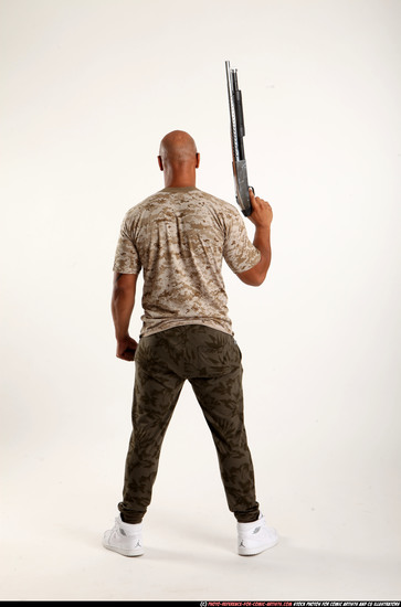 Man Adult Athletic Black Standing poses Army Fighting with shotgun