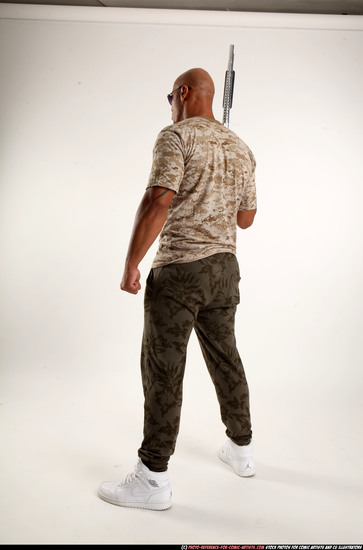 Man Adult Athletic Black Standing poses Army Fighting with shotgun