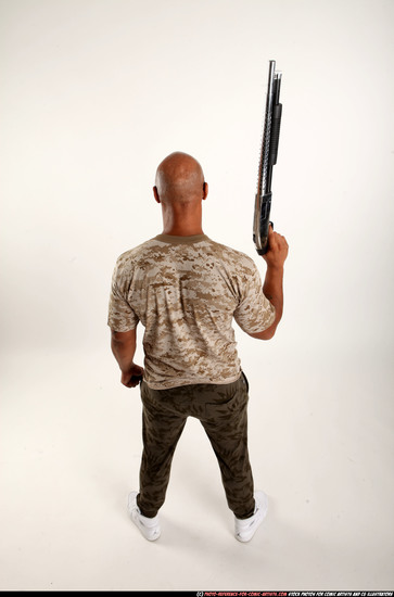 Man Adult Athletic Black Standing poses Army Fighting with shotgun