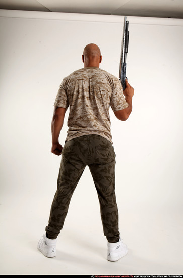 Man Adult Athletic Black Standing poses Army Fighting with shotgun