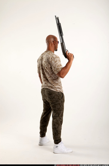 Man Adult Athletic Black Standing poses Army Fighting with shotgun