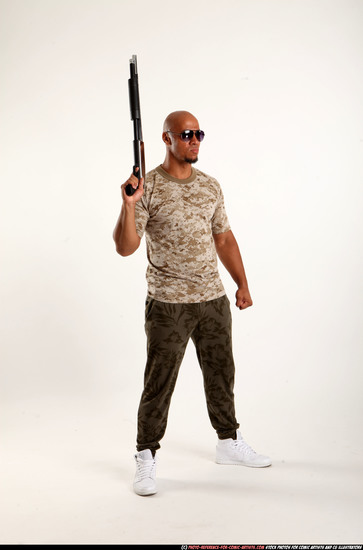 Man Adult Athletic Black Standing poses Army Fighting with shotgun