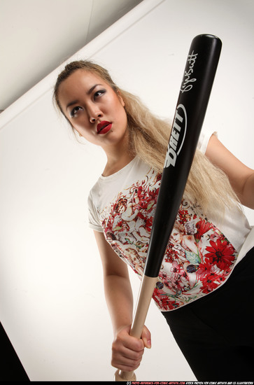 Woman Young Average Standing poses Casual Asian Fighting with bat