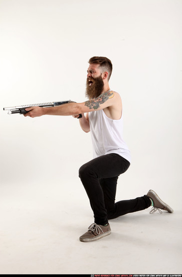 Man Adult Athletic White Kneeling poses Casual Fighting with shotgun