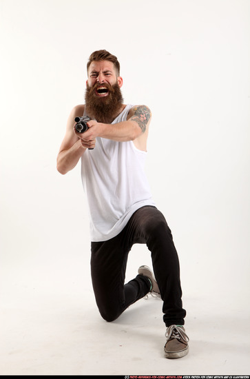 Man Adult Athletic White Kneeling poses Casual Fighting with shotgun