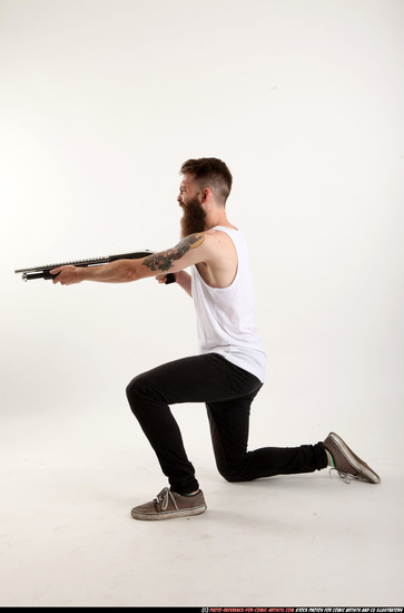 Man Adult Athletic White Kneeling poses Casual Fighting with shotgun