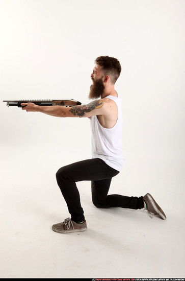 Man Adult Athletic White Kneeling poses Casual Fighting with shotgun