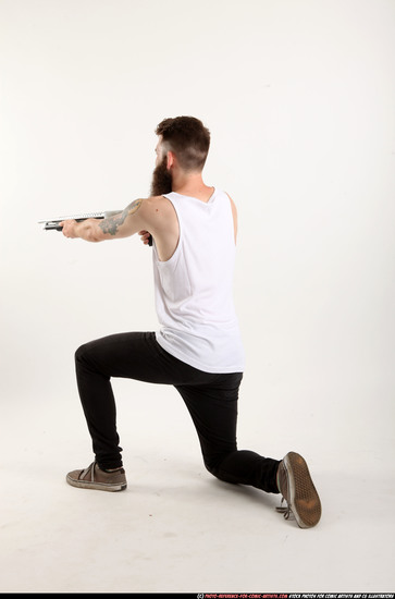 Man Adult Athletic White Kneeling poses Casual Fighting with shotgun