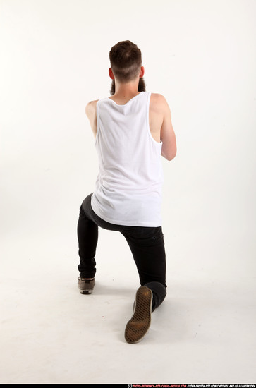 Man Adult Athletic White Kneeling poses Casual Fighting with shotgun