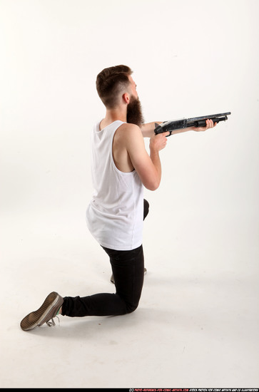 Man Adult Athletic White Kneeling poses Casual Fighting with shotgun