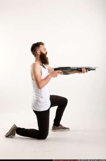 Man Adult Athletic White Kneeling poses Casual Fighting with shotgun