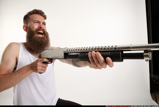 Man Adult Athletic White Kneeling poses Casual Fighting with shotgun