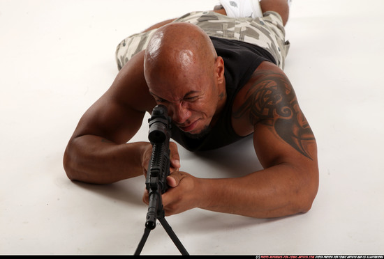 Man Adult Athletic Black Fighting with submachine gun Laying poses Army